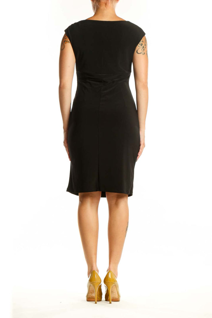 Black ruched cap sleeve cocktail dress with side ruching detail, back view