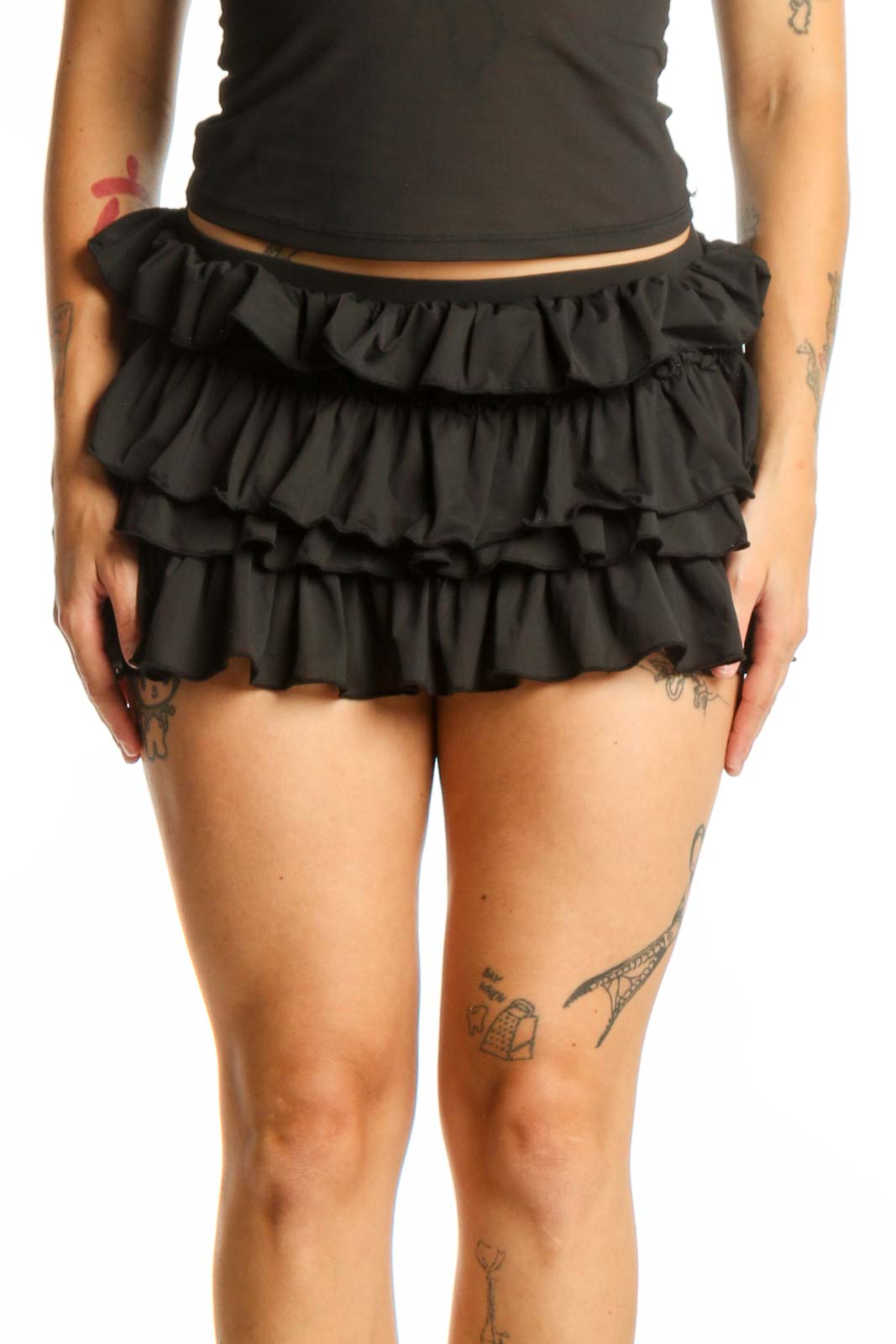 Black ruffle mini shorts with tiered ruffled detailing, high-waisted fit, front view