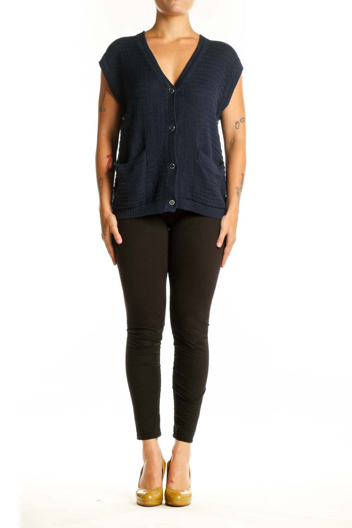 Navy cotton modal knit vest with V-neckline and button-front closure, worn with black pants