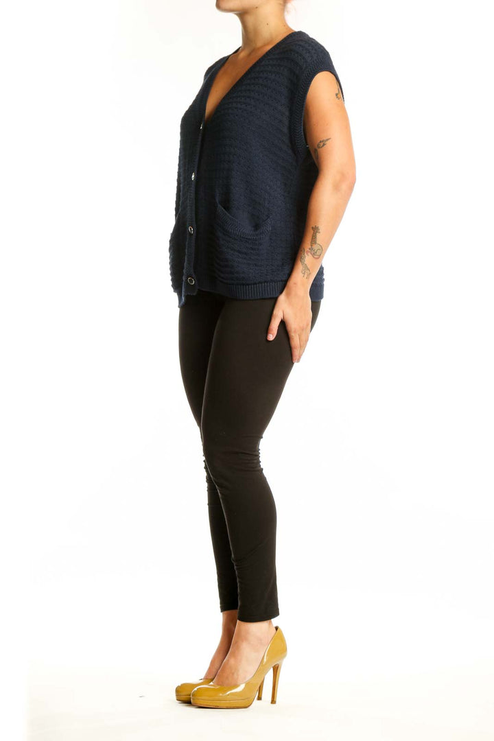Navy cotton modal knit vest with V-neckline and button-front closure, worn with black pants