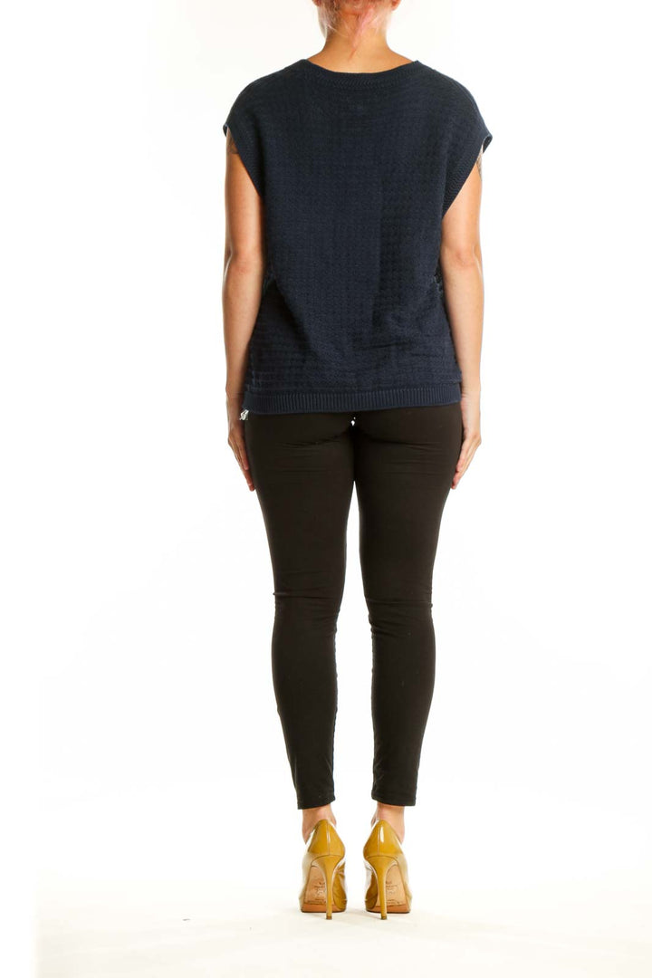 Back view of navy knit vest showing button-front design and relaxed fit silhouette