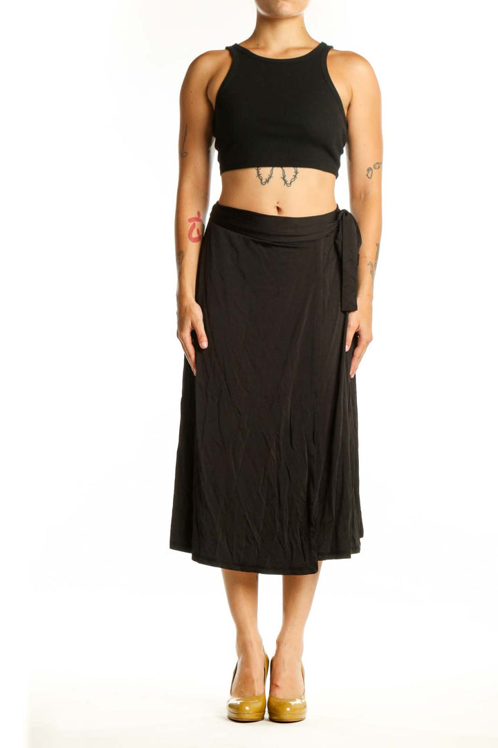 Black wrap midi skirt with tie detail and A-line silhouette by MB by Malene Birger, front view