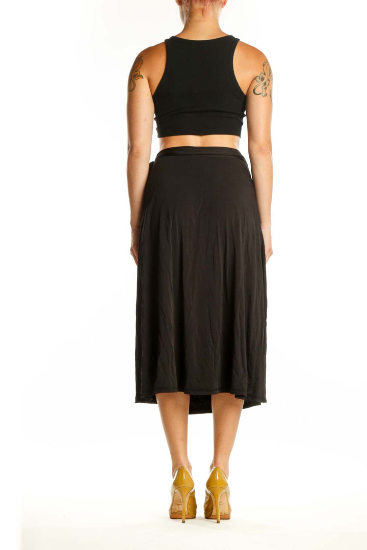 Black wrap midi skirt with tie detail and A-line silhouette by MB by Malene Birger, back view