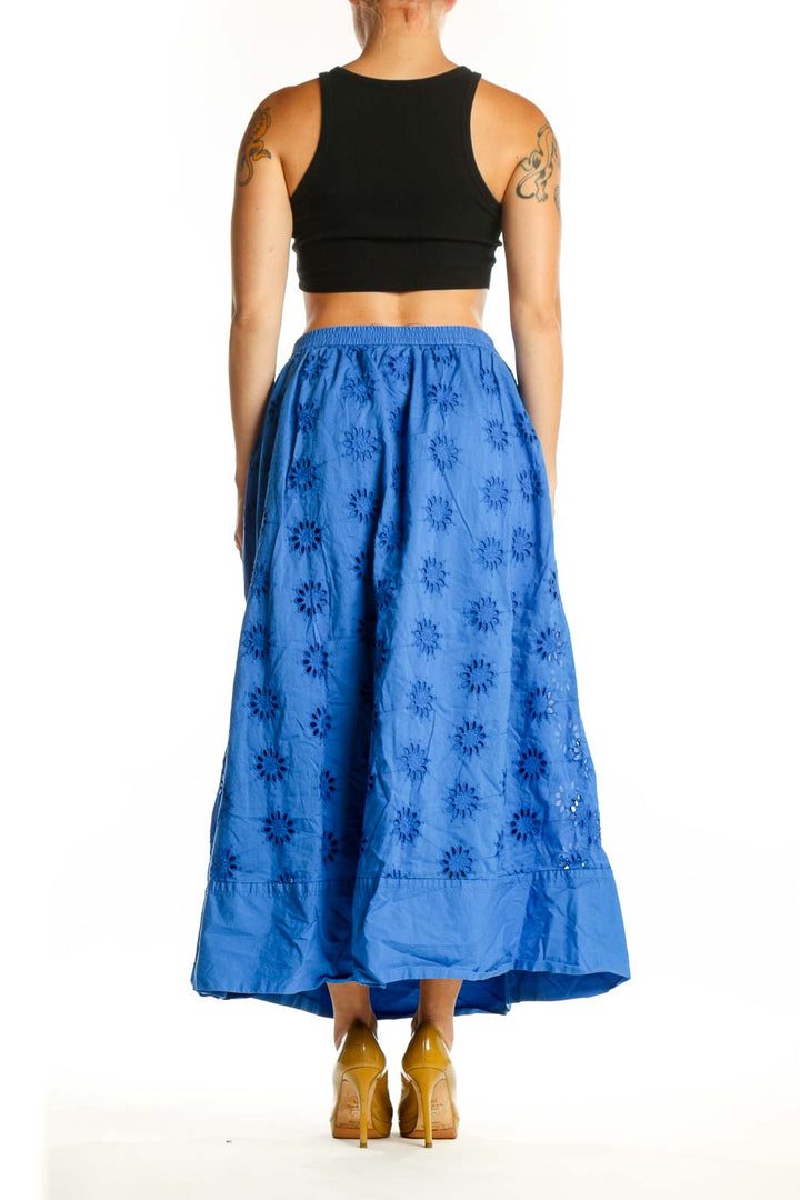 Blue floral print cotton maxi skirt with side pockets and ruffle hem detail, back view
