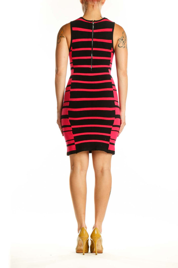 Red and black striped Bebe knit dress with sleeveless design and fitted back view