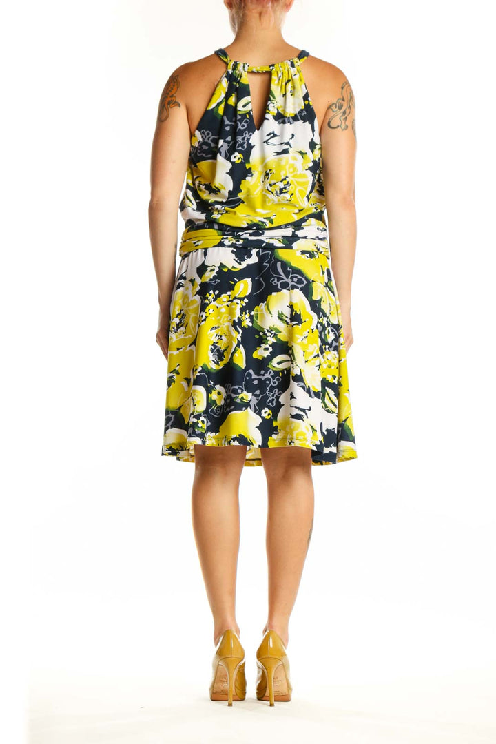 Yellow and navy floral halter neck dress with gathered waist by BCBG MaxAzria, back view