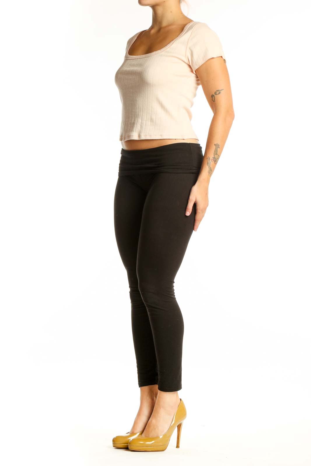 Cream ribbed crop top with short sleeves and rounded neckline, front view on model