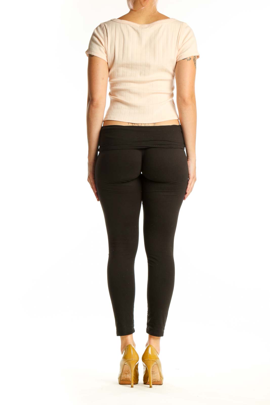 Cream ribbed crop top back view showing cropped silhouette and short sleeves