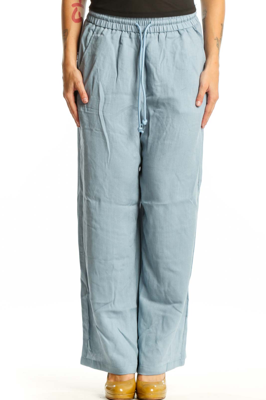 Blue wide leg drawstring pants with elastic waistband and side pockets, front view