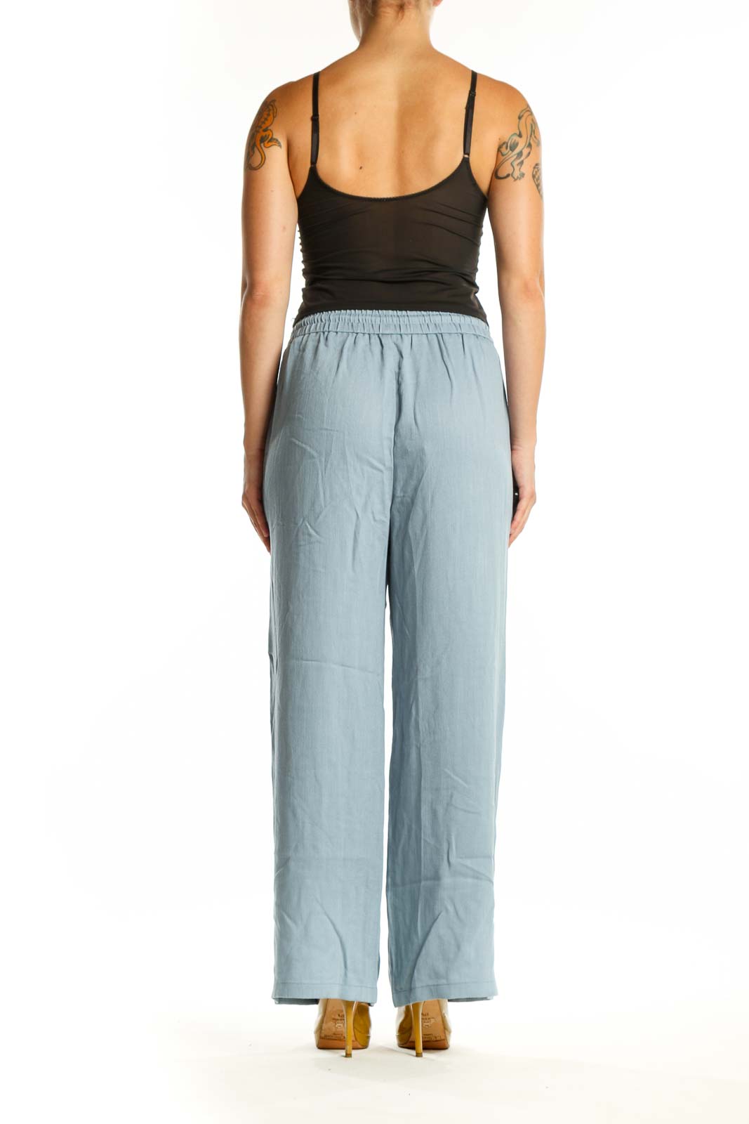 Blue wide leg drawstring pants with functional side pockets, back view