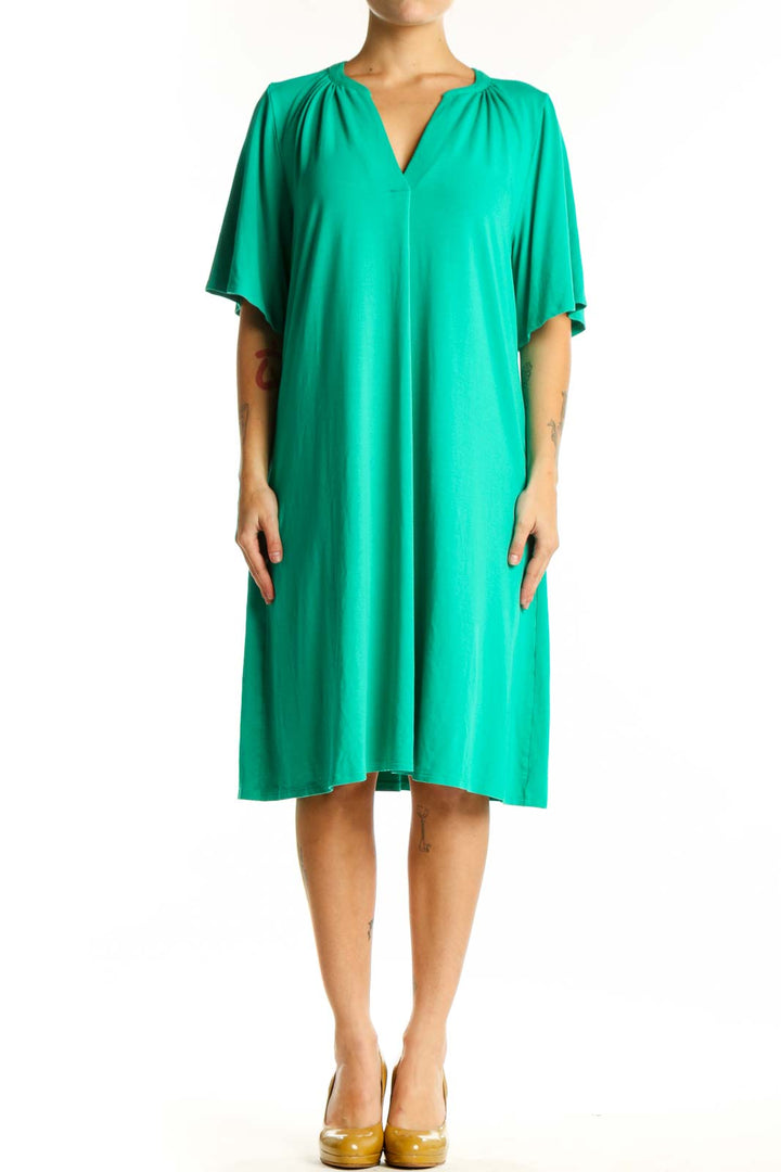 Front view of teal rayon A-line shift dress with V-neckline and gathered shoulder details