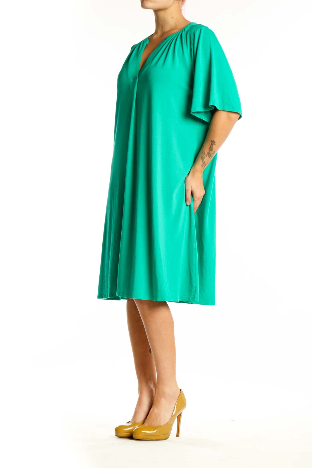 Front view of teal rayon A-line shift dress with V-neckline and gathered shoulder details