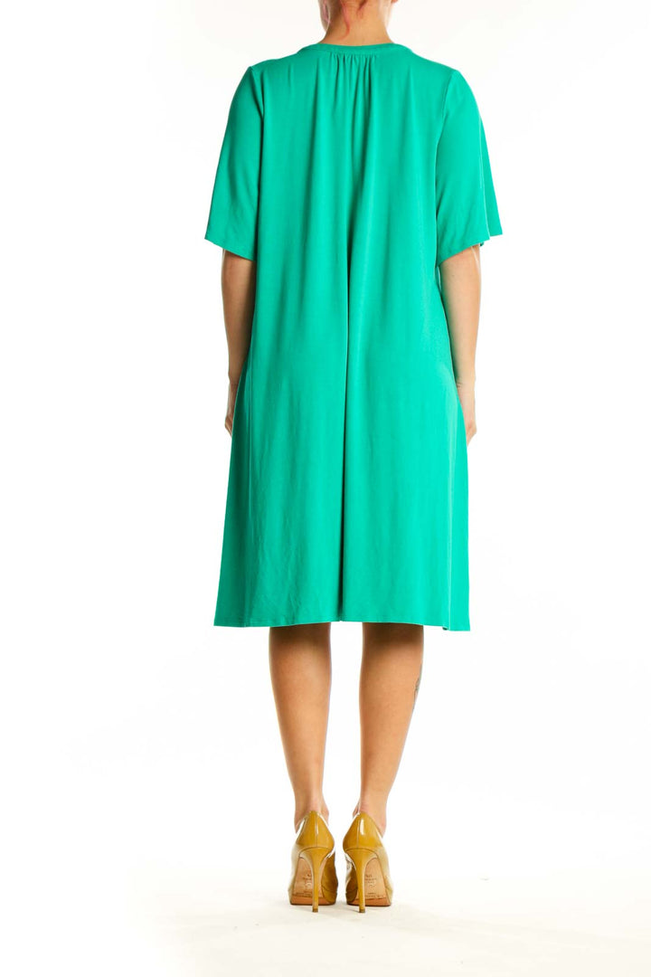 Back view of teal rayon A-line shift dress showing relaxed fit and knee-length cut