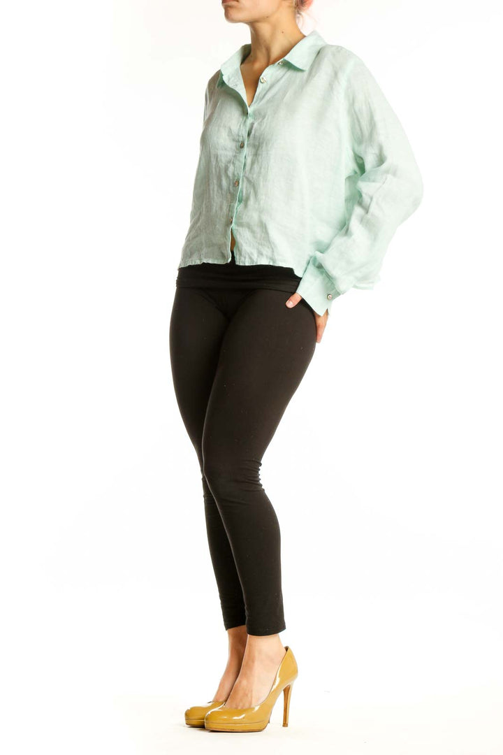 Mint green linen button-up crop shirt by Cynthia Rowley, front view showing cropped silhouette and collar detail