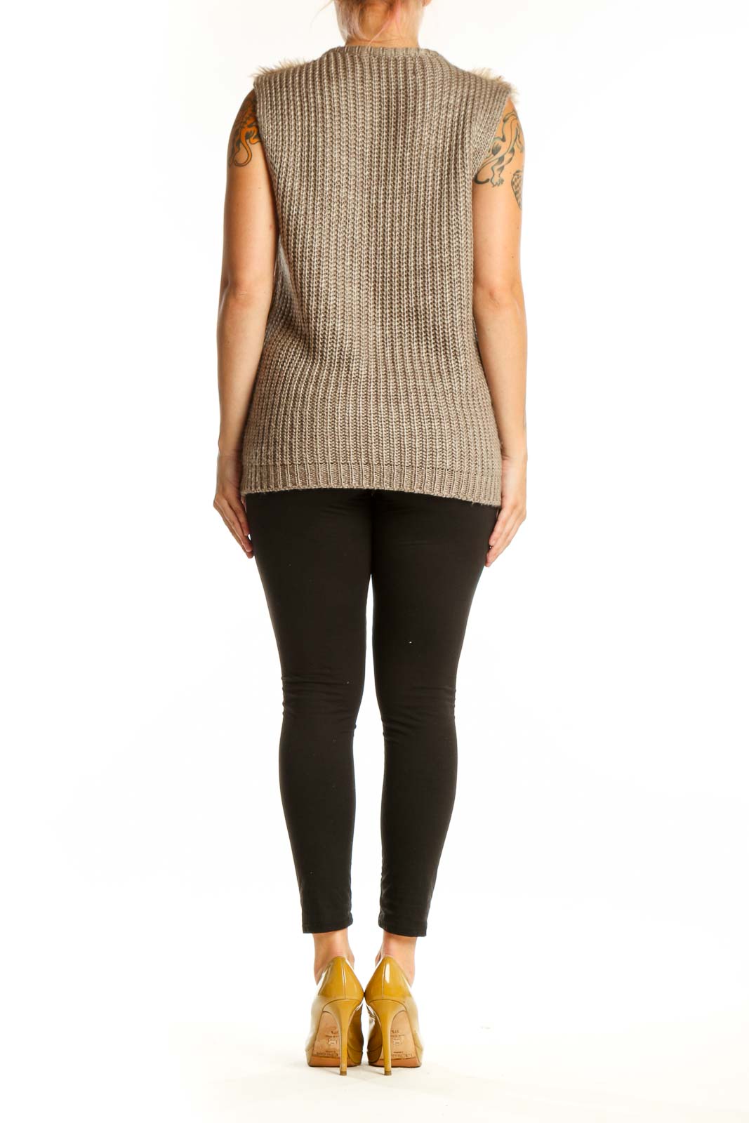 Back view of beige textured knit vest showing full-length zipper and sleeveless design