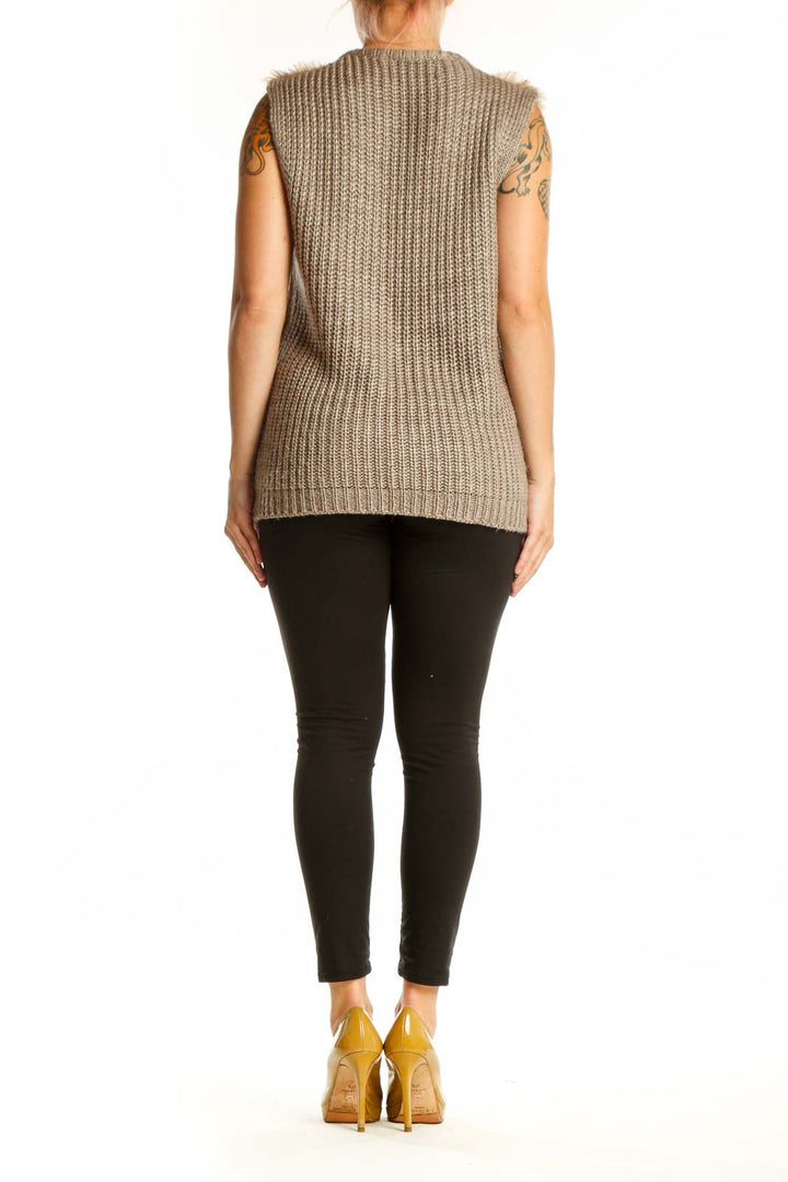 Back view of beige textured knit vest showing full-length zipper and sleeveless design