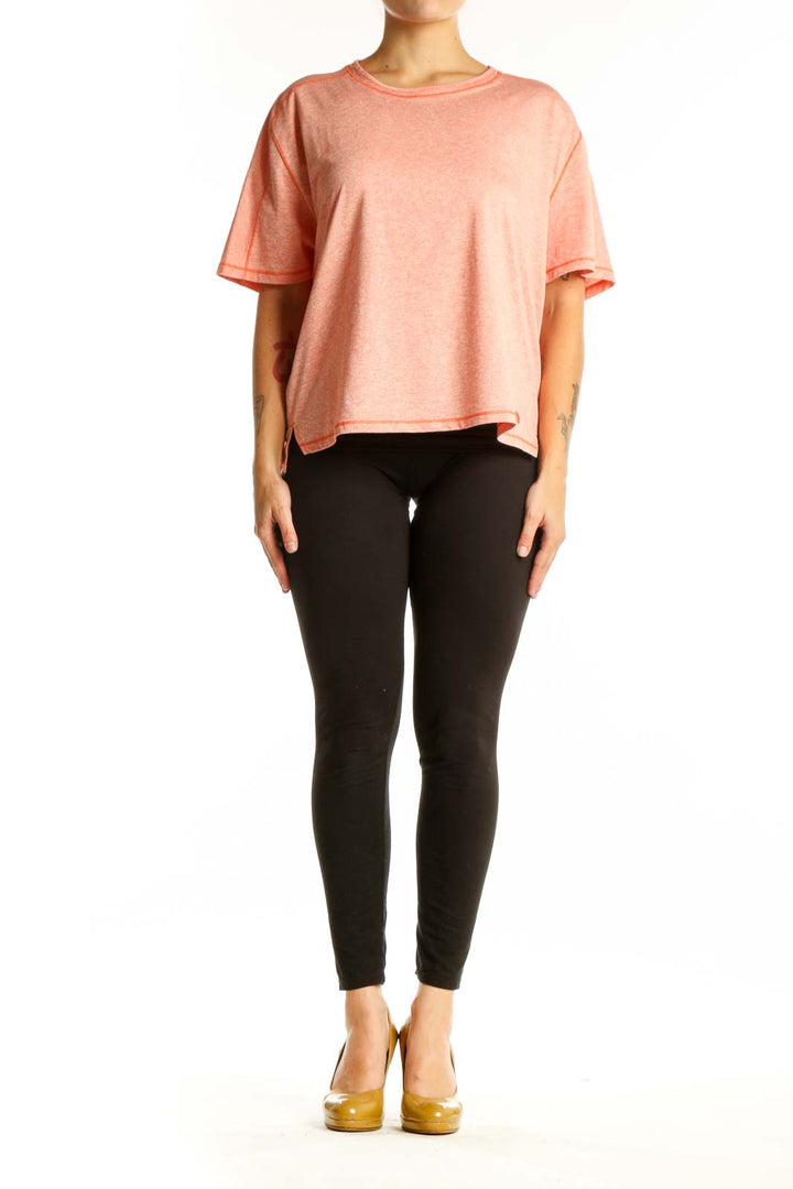 Coral heathered The North Face relaxed fit activewear tee front view on model