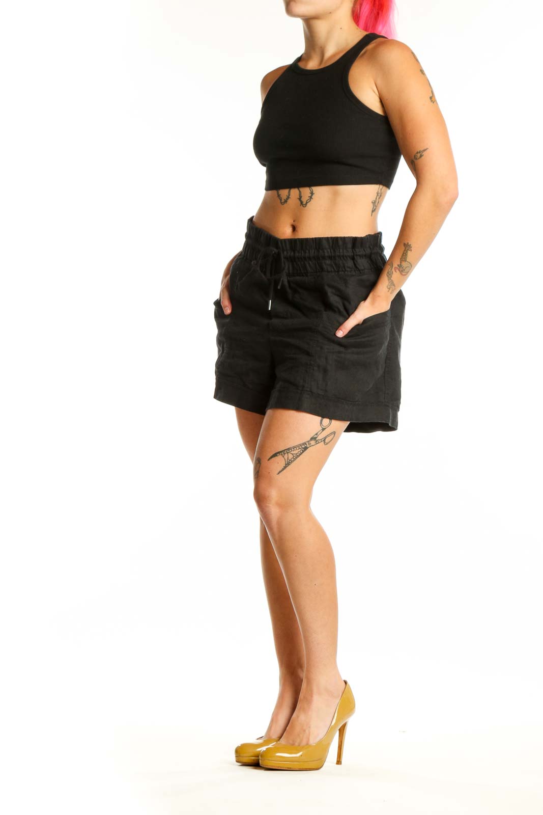 Black drawstring athletic shorts with elastic waistband and side pockets, front view