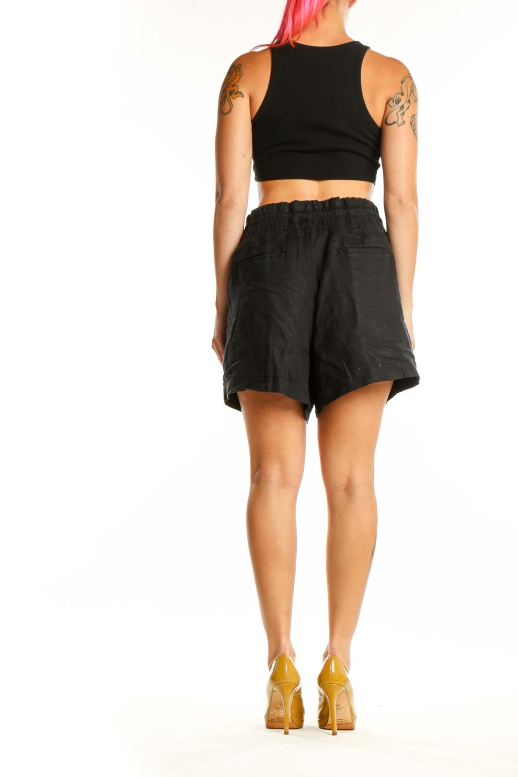 Black drawstring athletic shorts with functional pockets, back view