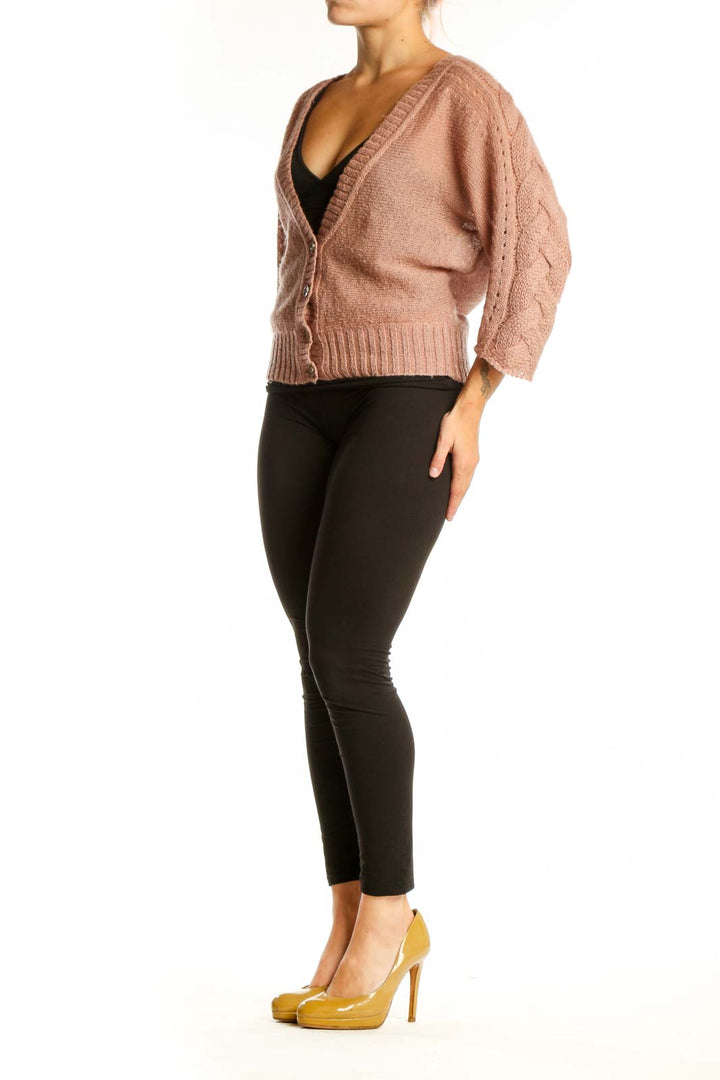 Beige mohair blend cardigan with V-neckline and button-front closure, worn over black top
