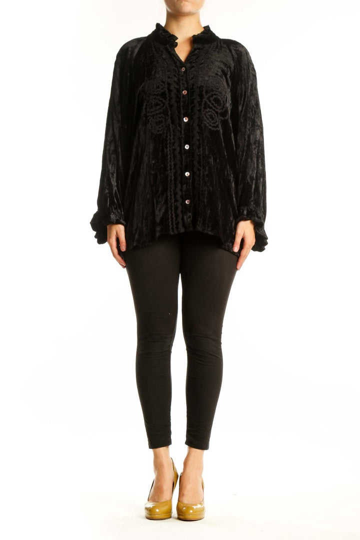 Black crushed velvet button-up blouse with ruffled collar and gathered sleeves, front view