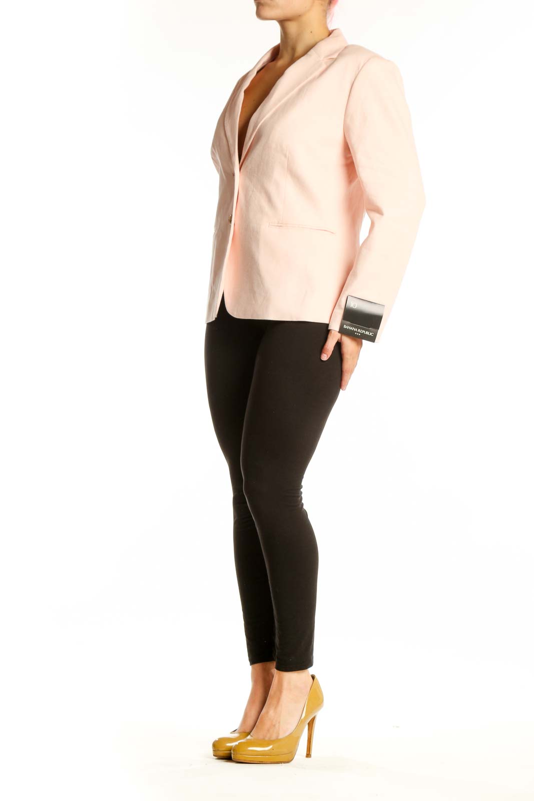 Blush pink Banana Republic blazer with notch lapels and gold-tone buttons, front view on model