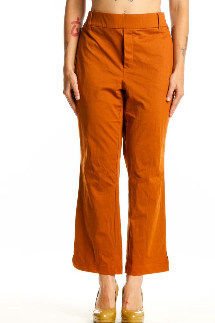 Front view of orange cropped polyester pants by Lands' End, size L, featuring high-waisted design and modern silhouette