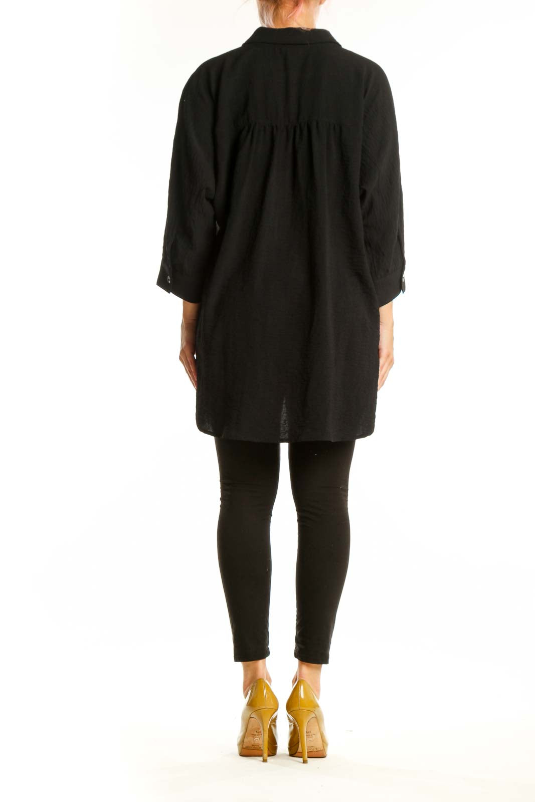 Black collared button-up tunic top with longer hemline and relaxed silhouette, back view
