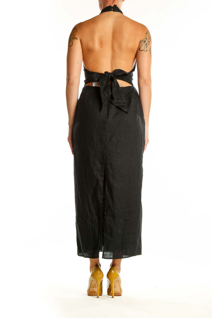 Black halter maxi dress with gathered bust and empire waist, back view