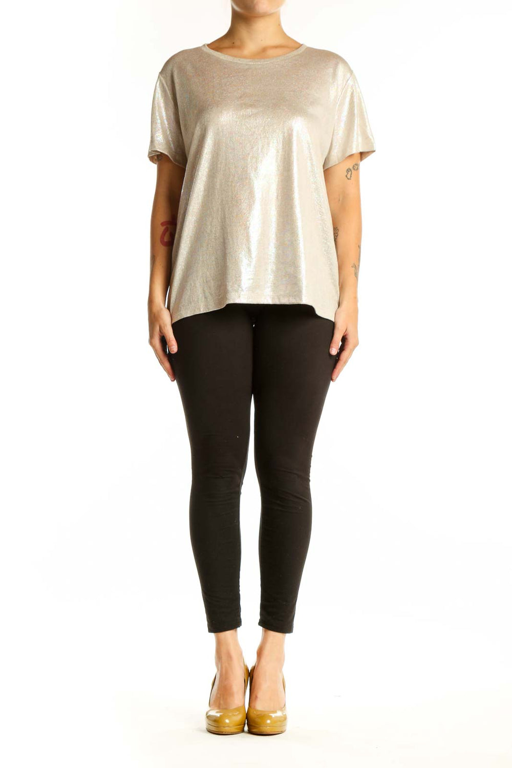 Gold metallic short sleeve top with crew neckline, front view on model wearing black leggings