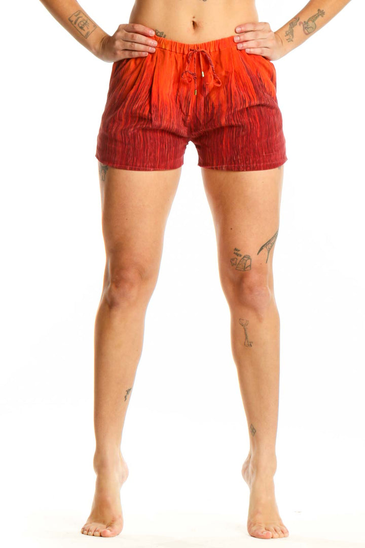 Red ombré silk shorts with drawstring waist, front view on model