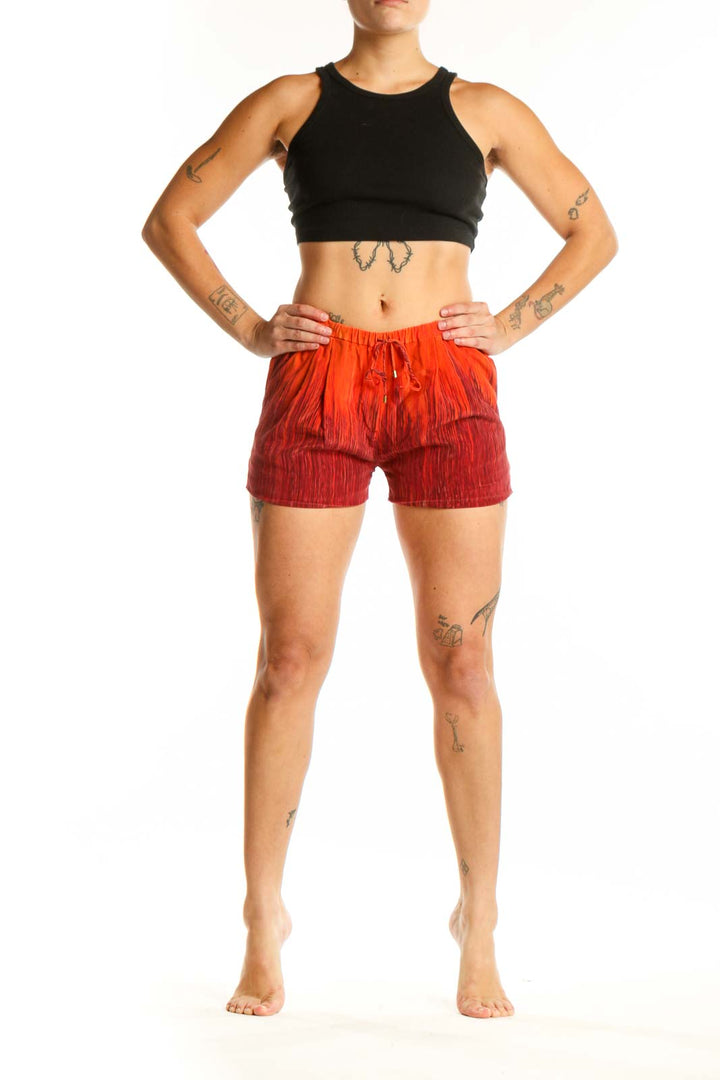 Red ombré silk shorts with drawstring waist, front view on model