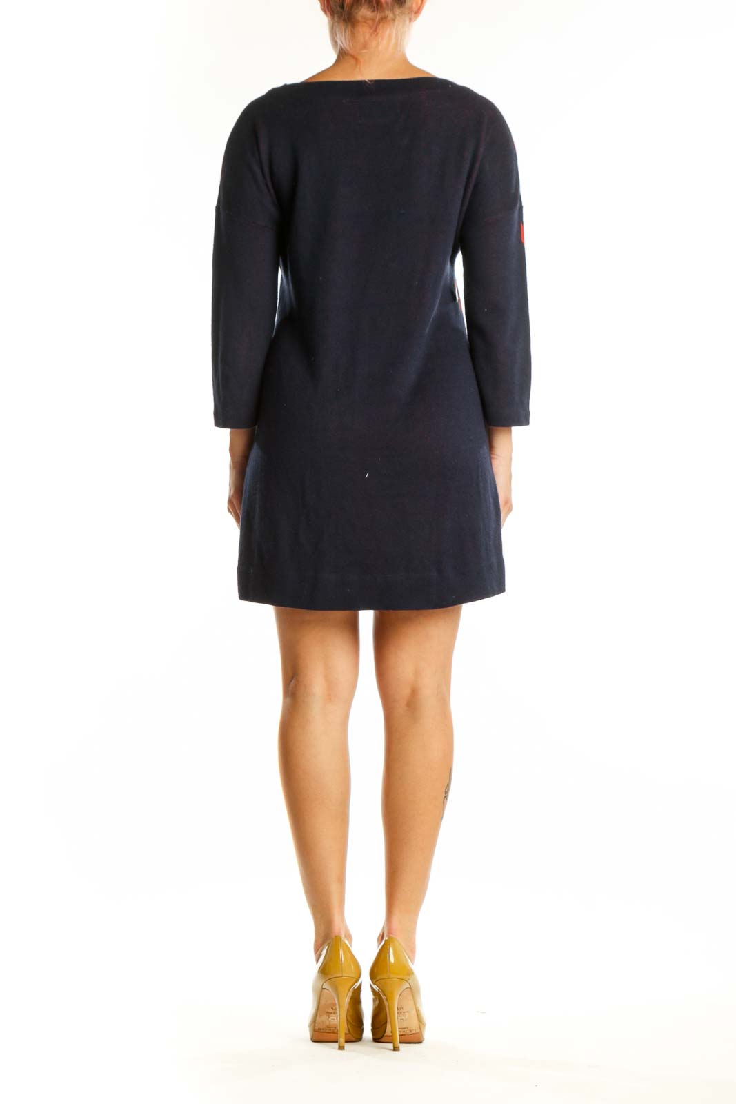 Navy knit dress with pink floral pattern, back view showing artistic botanical motif design