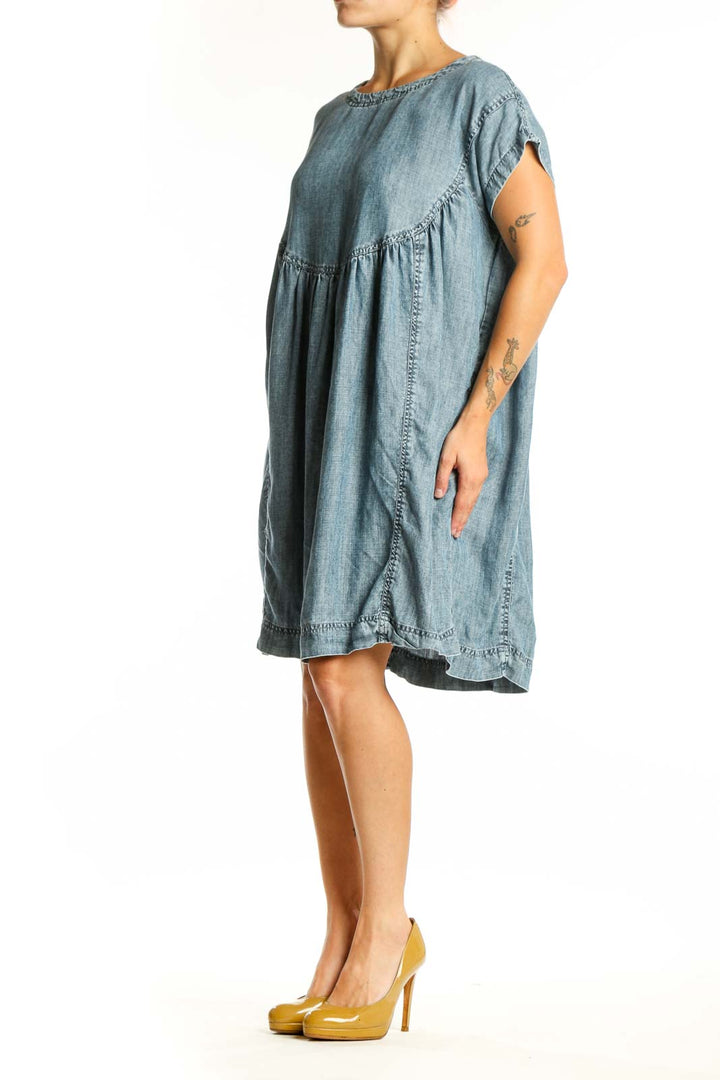Blue Tencel short sleeve dress with gathered waist and A-line silhouette, front view