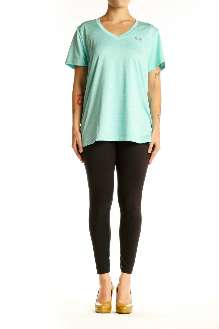 Mint green Under Armour V-neck athletic tee with short sleeves, front view on model