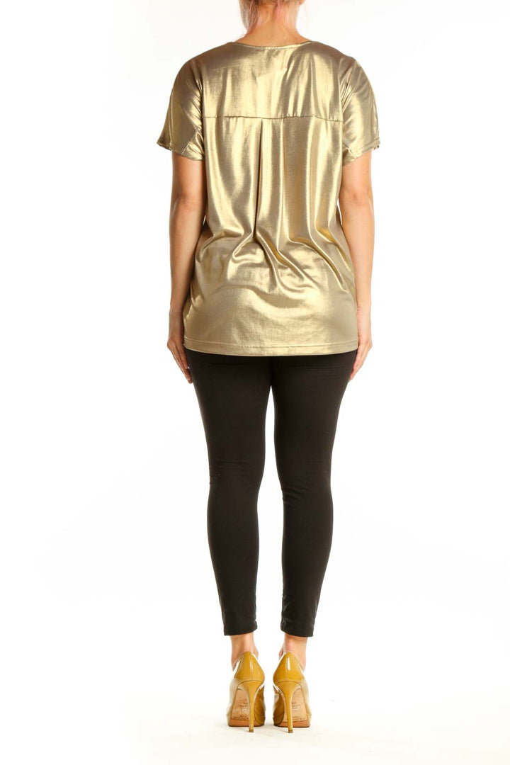 Gold metallic v-neck short sleeve top with stretch fabric, back view on model