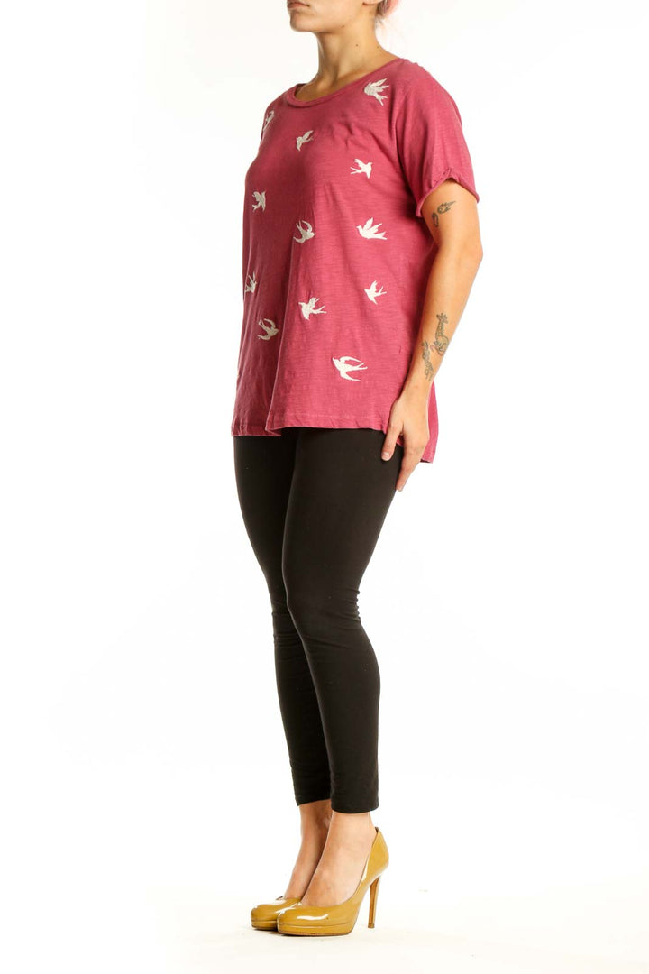 Burgundy short-sleeve tee with white bird print, front view on model