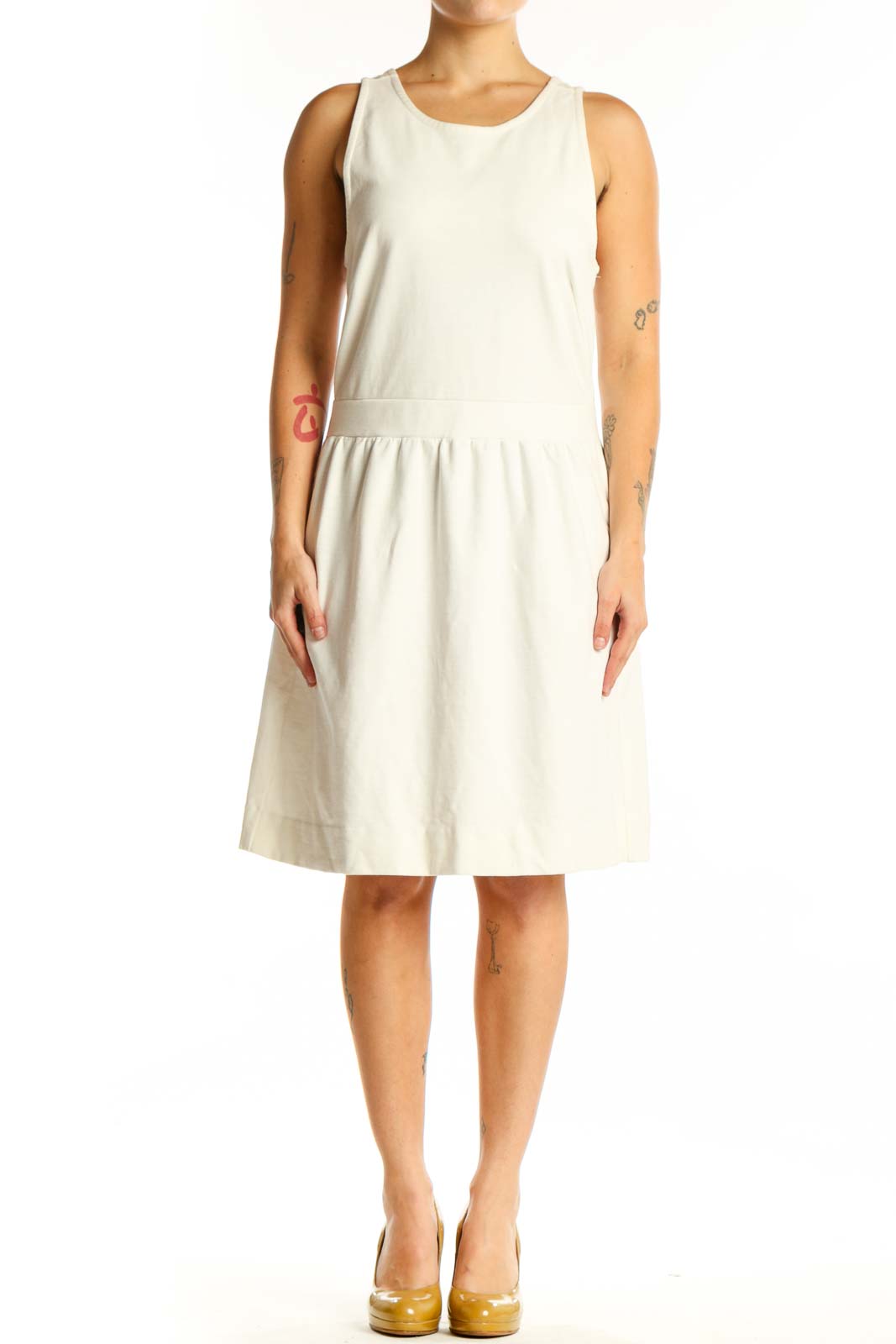 Cream sleeveless A-line dress with gathered waist, front view on model