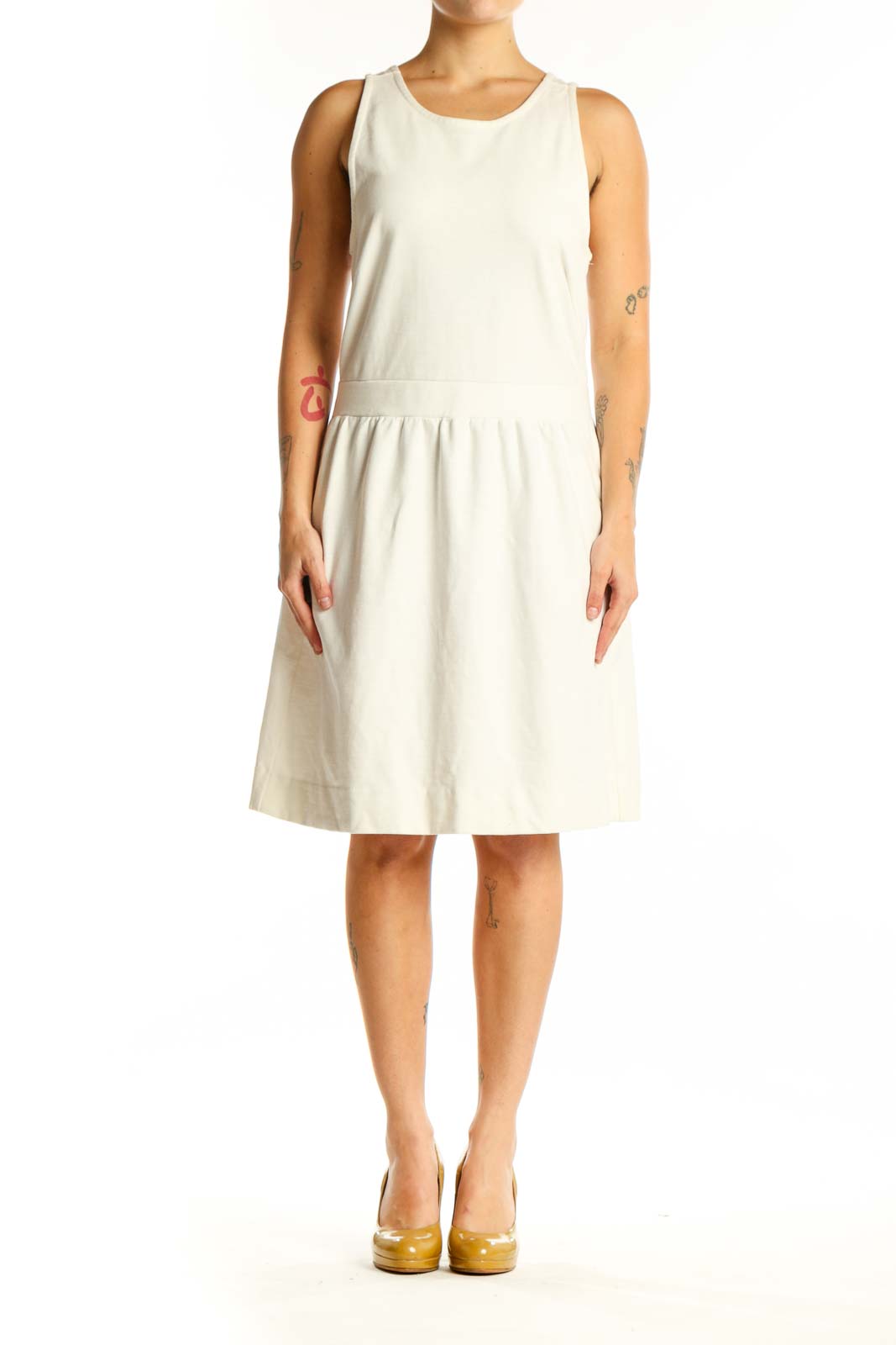 Cream sleeveless A-line dress with gathered waist, front view on model