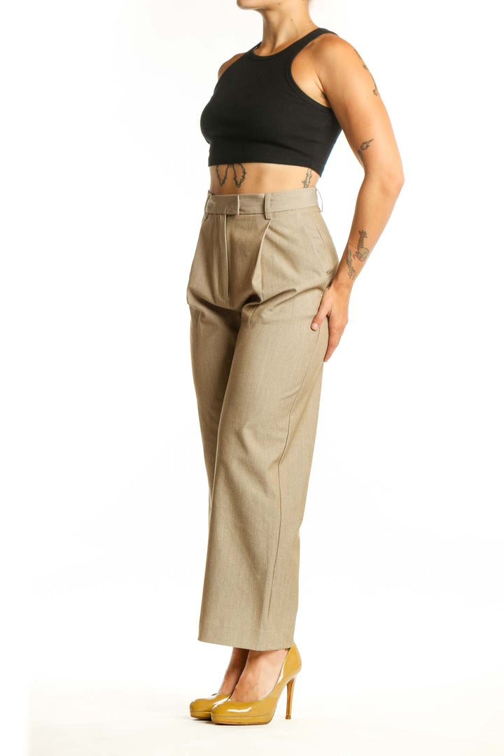 Front view of beige paperbag waist trousers with high-rise fit and cropped ankle length