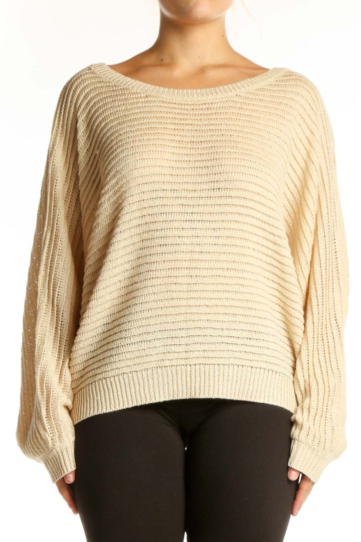 Cream ribbed knit sweater with balloon sleeves and oversized fit, front view