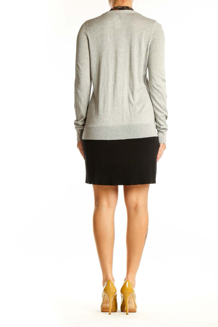 Back view of gray and black BCBG MaxAzria cardigan showing relaxed fit and draping