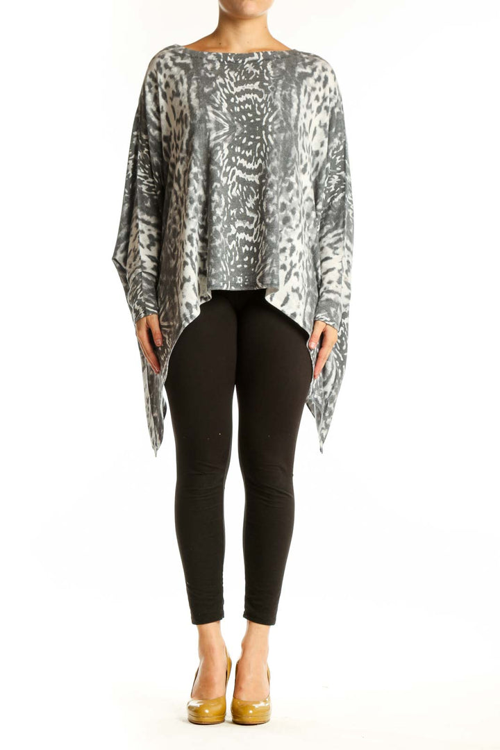 Gray and cream animal print asymmetrical knit top with long sleeves and oversized fit, front view
