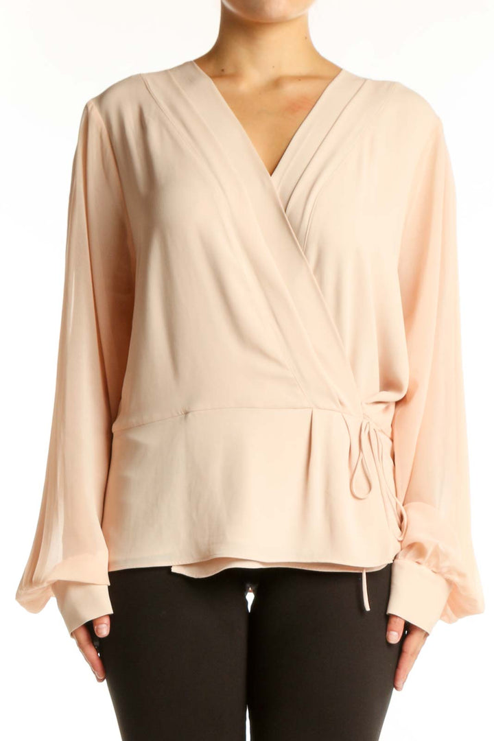 Cream wrap blouse with long sleeves and tie-waist detail, front view