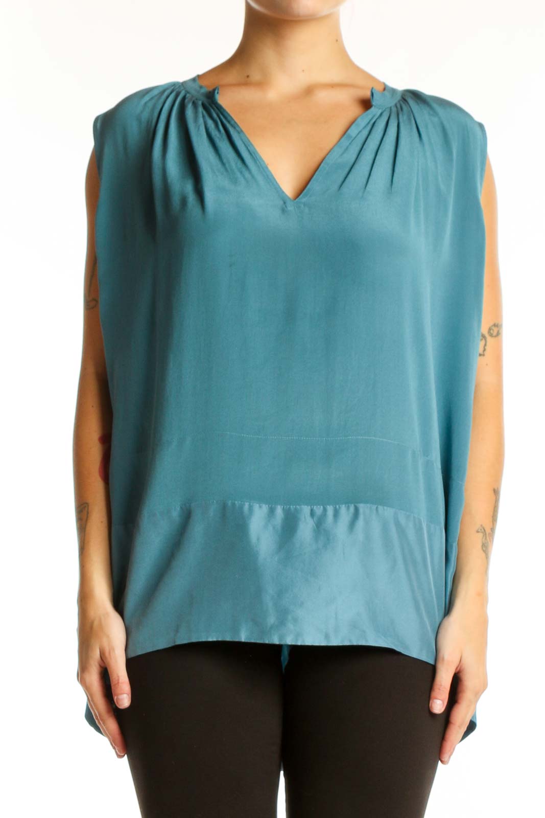 Teal sleeveless top with V-neckline and ruched shoulders, front view on model