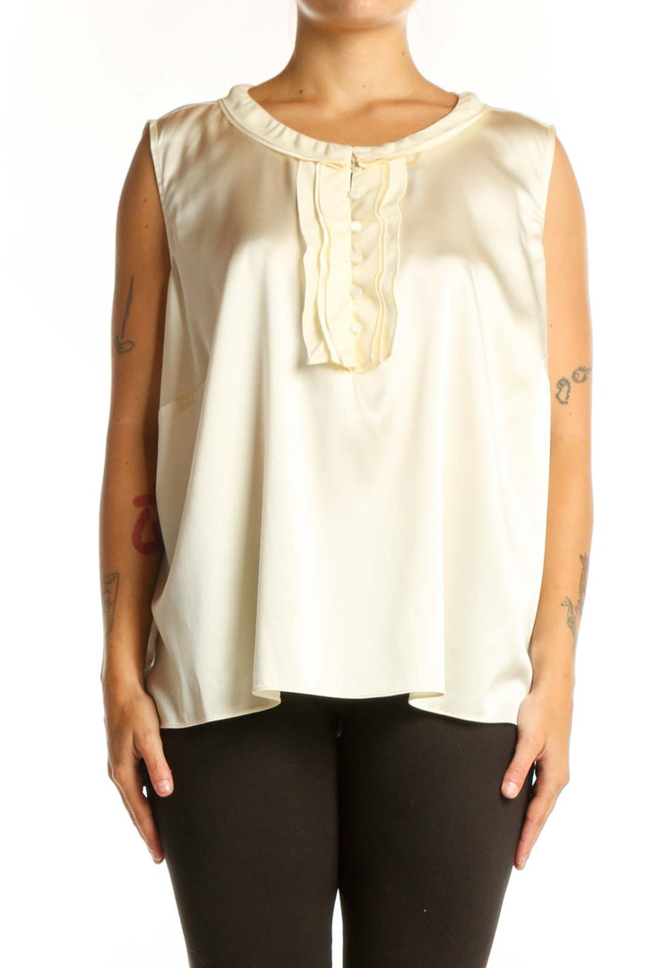 Cream silk sleeveless top with ruffle neckline detail, front view on model