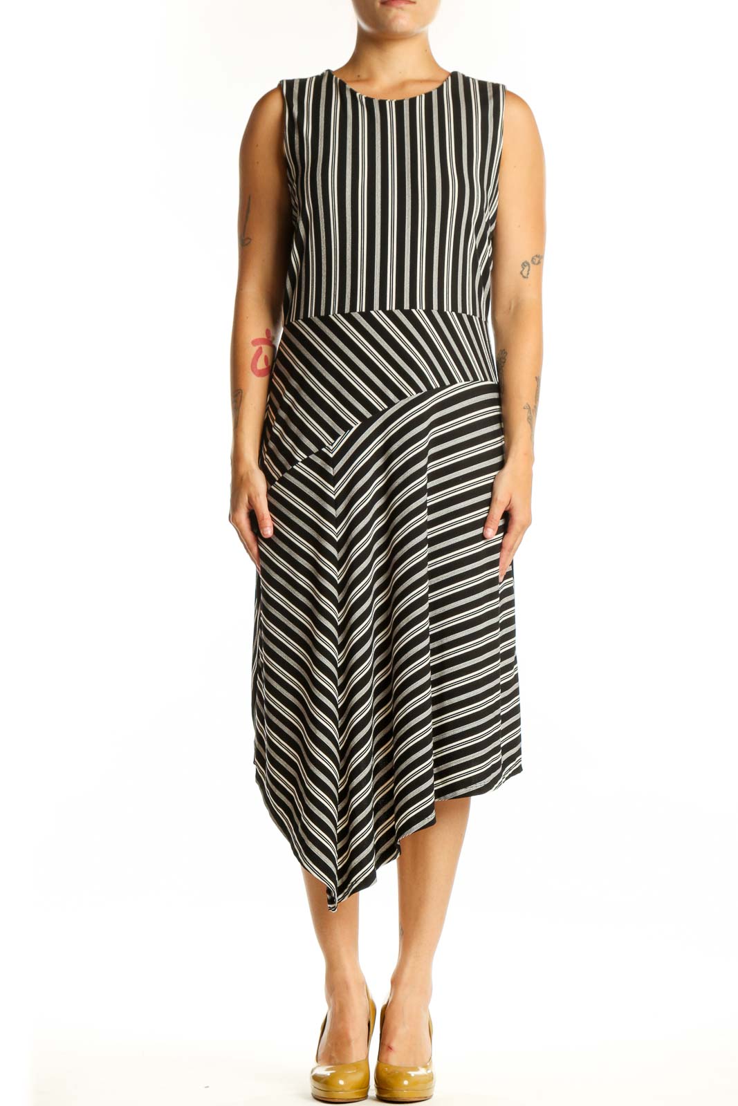 Black and white striped asymmetrical midi dress front view, sleeveless crew neckline design