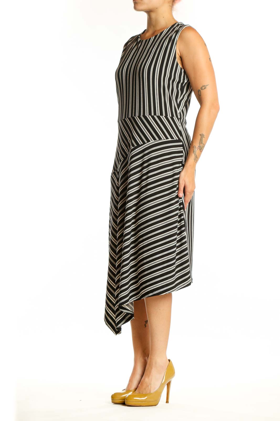 Black and white striped asymmetrical midi dress front view, sleeveless crew neckline design
