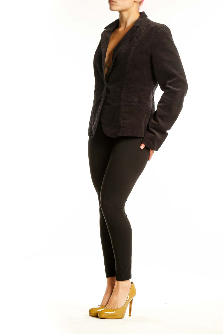 Black corduroy blazer with single button closure and notch lapels, front view