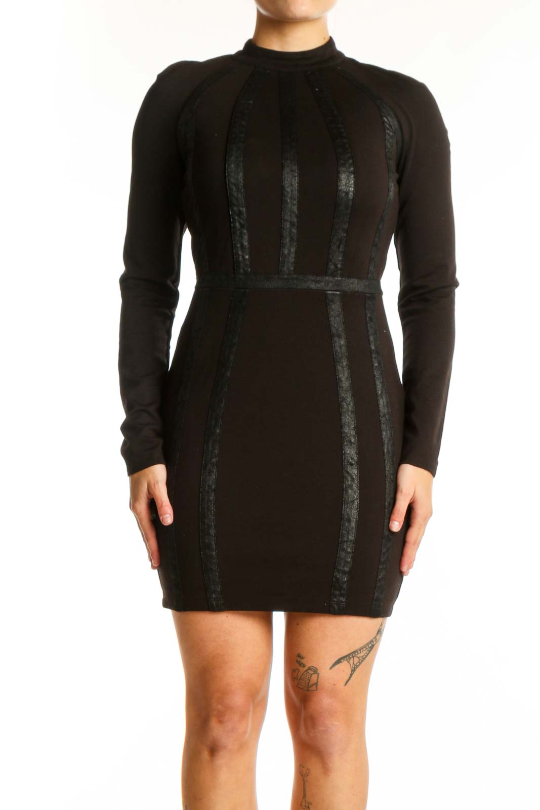 Black long sleeve bodycon dress with vertical lace panels by Bebe, front view